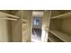 Walk-in closet with shelving leading to the bright, window-lit bedroom at 1301 Madison Ave, Las Vegas, NV 89106