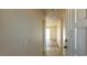 Bright entryway featuring neutral walls, decorative white door, and tile flooring that leads into the living area at 1301 Madison Ave, Las Vegas, NV 89106