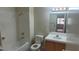 The bathroom features a shower-tub combo, toilet, sink, and a mirror, with tile flooring at 1325 Fiesta Grande Ct, North Las Vegas, NV 89031