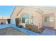 Charming single-story home featuring desert landscaping, a two-car garage, and unique architectural details at 1325 Fiesta Grande Ct, North Las Vegas, NV 89031
