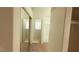 The hallway leads to a bathroom and a closet with mirrored doors and a carpet floor at 1325 Fiesta Grande Ct, North Las Vegas, NV 89031