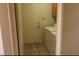 Laundry room with tile flooring, washing machine, dryer, and access door at 1325 Fiesta Grande Ct, North Las Vegas, NV 89031