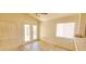 Bright living area features tiled flooring, large windows, and sliding glass doors at 1325 Fiesta Grande Ct, North Las Vegas, NV 89031