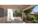 Covered patio area with desert landscaping at 1325 Fiesta Grande Ct, North Las Vegas, NV 89031
