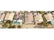 Aerial view of a home with a private pool, solar panels and a well-manicured yard in a residential neighborhood at 1339 Echo Creek St, Henderson, NV 89052
