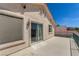 Exterior view of a balcony with stucco walls, sliding glass doors, and railings, offering outdoor living space at 1339 Echo Creek St, Henderson, NV 89052
