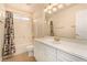 Bright bathroom with white cabinets, a single sink, and a shower-tub combination with a curtain at 1339 Echo Creek St, Henderson, NV 89052