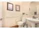 Cozy powder room featuring a pedestal sink and decorative art at 1339 Echo Creek St, Henderson, NV 89052