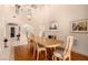 Bright dining room features neutral walls, lovely wood table with upholstered chairs, and decorative accents at 1339 Echo Creek St, Henderson, NV 89052