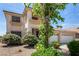 Two-story home featuring a three-car garage, light-colored exterior, and well-manicured landscaping at 1339 Echo Creek St, Henderson, NV 89052