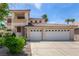 Two-story home featuring a three-car garage, light-colored exterior, and a sunny sky at 1339 Echo Creek St, Henderson, NV 89052