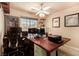 Office space with a large desk, multiple monitors, and decorative wall art at 1339 Echo Creek St, Henderson, NV 89052