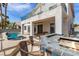 Charming backyard with a covered patio, outdoor kitchen, pool, and spa, offering a relaxing retreat at 1339 Echo Creek St, Henderson, NV 89052