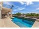 Stunning pool and patio area featuring a built-in barbecue, bar, and ample seating for outdoor entertaining and relaxation at 1339 Echo Creek St, Henderson, NV 89052