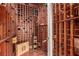 Spacious wine cellar with wood racking, climate control, and hardwood floors at 1339 Echo Creek St, Henderson, NV 89052