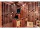 Custom wine cellar featuring extensive wood racking, a small desk and computer, and bottle storage at 1339 Echo Creek St, Henderson, NV 89052