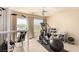Workout room with an elliptical machine, weights, and natural light from the large window at 1339 Echo Creek St, Henderson, NV 89052