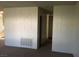 The living room is spacious and bright with carpeted floors at 146 Greenbriar Townhouse Way, Las Vegas, NV 89121