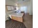View of the open kitchen area, showcasing the kitchen island, and access to the backyard at 2100 Fred Brown Dr, Las Vegas, NV 89106