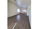 Open floor plan with living room featuring hard surface floors, leads to kitchen area with island at 2100 Fred Brown Dr, Las Vegas, NV 89106