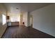 Spacious open concept living room with wood-look floors, view into the open kitchen at 2100 Fred Brown Dr, Las Vegas, NV 89106