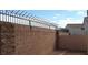 This block wall is capped with wrought iron at 2100 Fred Brown Dr, Las Vegas, NV 89106