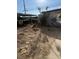 Exterior shot of a home with a backyard that has potential for landscaping at 2109 Glider St, North Las Vegas, NV 89030