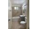 Bathroom featuring tile flooring, a tub-shower, and modern vanity at 2109 Glider St, North Las Vegas, NV 89030