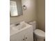 Features a sink, vanity, and toilet at 2109 Glider St, North Las Vegas, NV 89030
