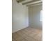 Bedroom showcasing tiled flooring, a window, and potential for customization at 2109 Glider St, North Las Vegas, NV 89030