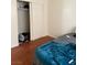 Bedroom featuring hardwood floors and a bed with linens at 2109 Glider St, North Las Vegas, NV 89030