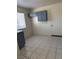 Kitchen featuring tiled flooring and blue cabinets at 2109 Glider St, North Las Vegas, NV 89030