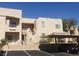 Exterior view of condo complex featuring parking, balconies, and desert landscaping at 2200 Highpointe Dr # 201, Laughlin, NV 89029