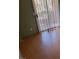 Bright living room featuring wood-look flooring and sliding glass doors to the balcony at 2200 Highpointe Dr # 201, Laughlin, NV 89029