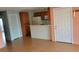 View of the living room with adjoining kitchen and entry door at 2200 Highpointe Dr # 201, Laughlin, NV 89029