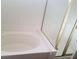 Bathroom featuring a tub with shower and glass door at 227 Big Horn Dr, Boulder City, NV 89005