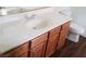 Bathroom vanity featuring oak cabinetry, white sink and toilet at 227 Big Horn Dr, Boulder City, NV 89005