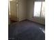 Bedroom with carpet and a view of the exterior through a window at 227 Big Horn Dr, Boulder City, NV 89005