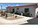 Beige single-story home with low maintenance landscaping, tile roof, and visible unit numbers near the entrance at 227 Big Horn Dr, Boulder City, NV 89005