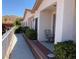 Beige home exterior with a tile roof, walkway, patio and mountain views in the background at 227 Big Horn Dr, Boulder City, NV 89005