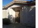 Home exterior featuring a solid brown front door with a covered entryway and address number at 227 Big Horn Dr, Boulder City, NV 89005