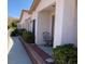 Inviting front entrance with covered porch, seating, and well-maintained landscaping at 227 Big Horn Dr, Boulder City, NV 89005