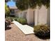 Attractive home exterior featuring tidy landscaping and a walkway leading to the entrance at 227 Big Horn Dr, Boulder City, NV 89005