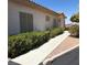 Charming single-story home featuring desert landscaping and a walkway to the front door at 227 Big Horn Dr, Boulder City, NV 89005