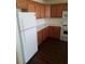 A kitchen featuring wooden cabinets, white appliances, and laminate countertops at 227 Big Horn Dr, Boulder City, NV 89005