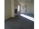 Bright living room with carpet, natural light, fireplace, and a ceiling fan at 227 Big Horn Dr, Boulder City, NV 89005
