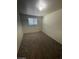 Bedroom featuring carpet, a window, and plain walls at 2564 San Marcos St, Las Vegas, NV 89115