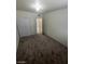 This bedroom features a closet with bi-fold doors, neutral paint, and a large window for natural light at 2564 San Marcos St, Las Vegas, NV 89115