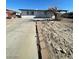 View of a single-story home featuring a concrete driveway and desert landscaping at 2564 San Marcos St, Las Vegas, NV 89115