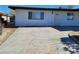 Exterior view of a single-story home featuring a cracked concrete driveway and a white facade at 2564 San Marcos St, Las Vegas, NV 89115